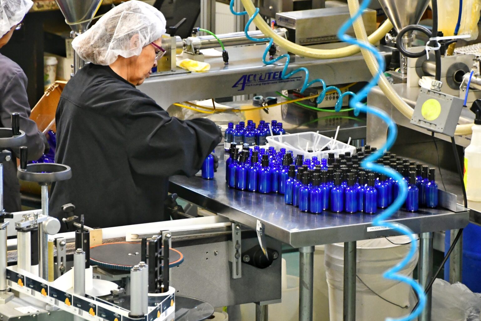 Bottles moving down the Chaé production line