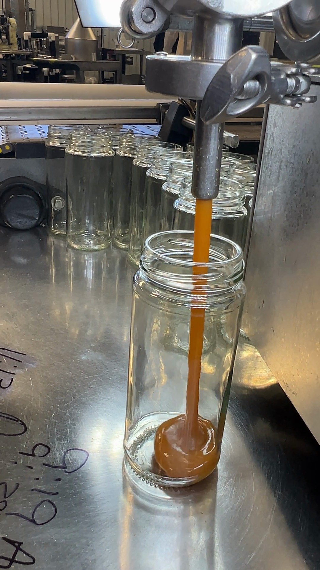 Honey-based product being filled into a jar at Chaé Manufacturing